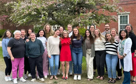AOTA President Alyson Stover poses with students and faculty from UNE’s Department of Occupational Therapy