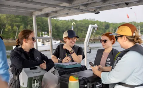 Kara Mickiewicz, Michelle Caputo, and other UNE students