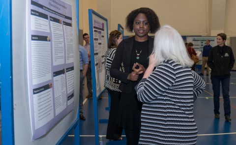 Student researcher Amanda Anderson explains her poster.