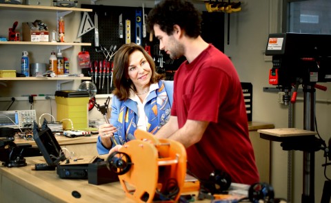 Matt Scheuer explains his project to UNE President Danielle Ripich during her recent visit to the Makerspace. 