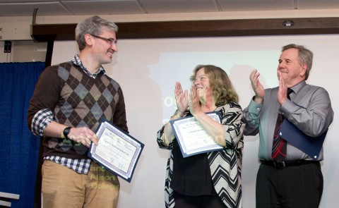 Craig Tennenhouse (left) receives the Excellence in Academic Advising Award for the College of Arts and Sciences, as Christine F