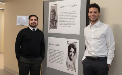 John Contreras and Brandon Barnett in front of the Black History Month display in Innovation Hall