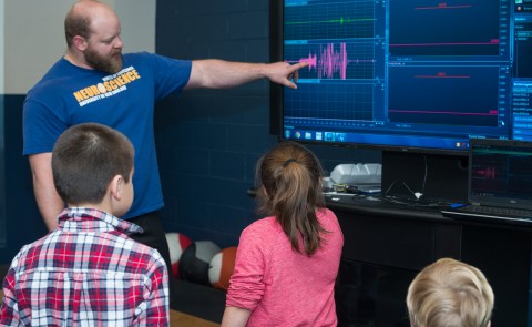 UNE's Mike Lawrence leads an exhibit at the Brain Fair