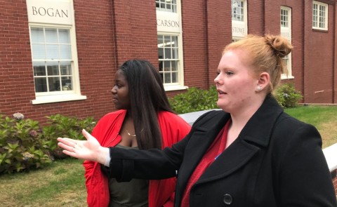 UNE College of Pharmacy student Brianna Gower shows Deering High School student Lea Yere around campus