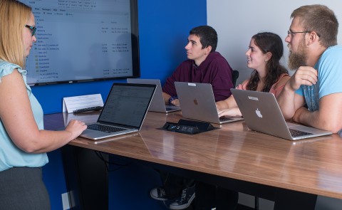 UNE students sit in a data science class