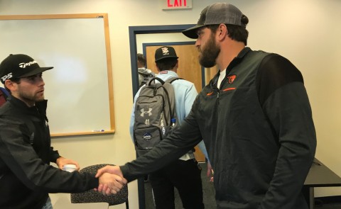 San Francisco Giants pitcher Josh Osich greets UNE students after class