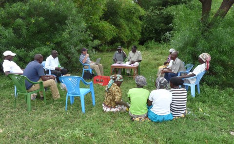 Rick Peterson (left of center table) and one of his Kenyan co-authors Peter Nyabua (center table, right) conduct a focus group w