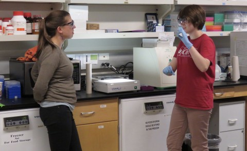 Eva Rose Balog and student researcher Laura Marvin in the lab
