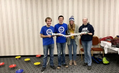 UNE Math Club members Shawn Pilling, Nick Paolini and Cassidy Smith with club advisor Jennifer Fatula