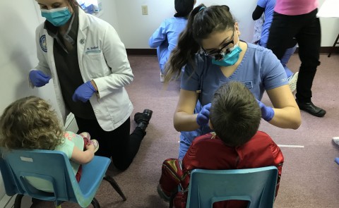 Students from UNE COM and the WCHP provide oral health screenings at the Brunswick Head Start, Oct. 31, 2019.