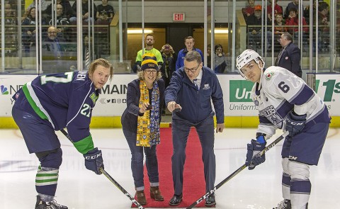 President James Herbert joins USM Provost Jeannine Uzzi to drop the puck at Maine Mariners game