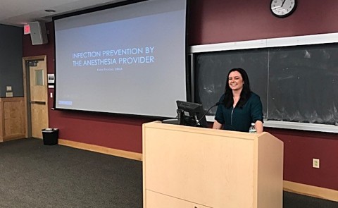 Kara Pavone gives an oral presentation of her project Infection Prevention by the Anesthesia Provider