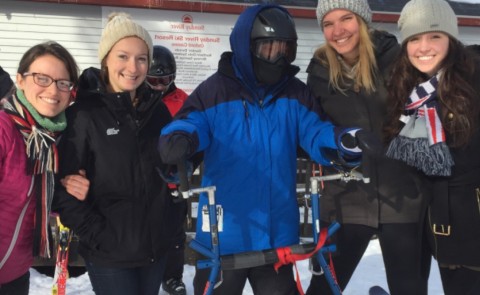 UNE physical therapy students work with a participant in Maine Adaptive Sports and Recreation's Ski-A-Thon.