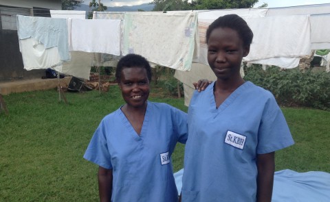 Health workers in Uganda wear scrubs donate by UNE medical students