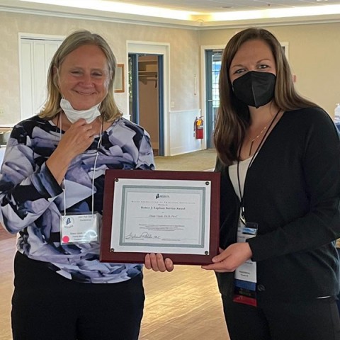Diane Visich accepts an award from the Maine Academy of Physician Assistants