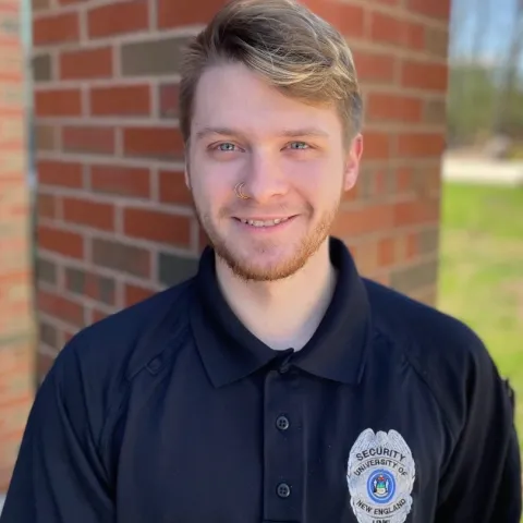 Headshot of U N E employee Tyler Santamore