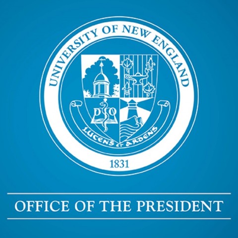 A white graphic with the UNE official seal and text saying "Office of the President" over a blue background