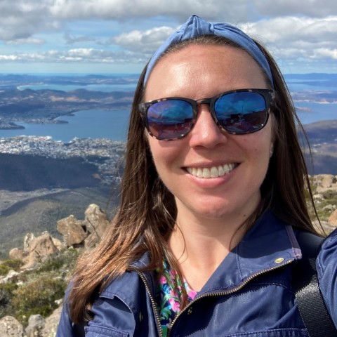 UNE professor Patricia Thibodeau poses with Hobart, Tasmania in the background