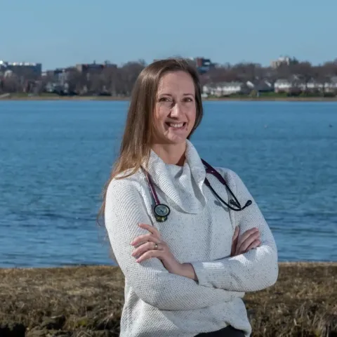 Portrait of Bethany Miles posing in front of Portland's Back Cove