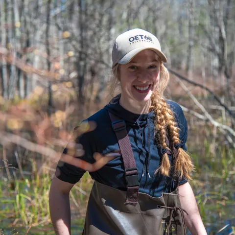 2024 Sustainability Fellow Juliann LaPierre poses for a portrait in the UNE forest 