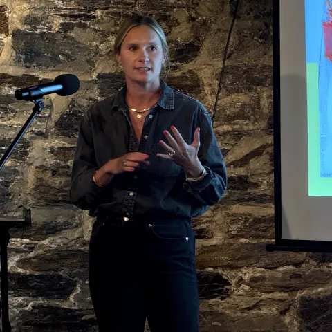Photo of Julie Longua Peterson giving a presentation