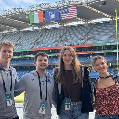 Four UNE students worked at NFL game in Ireland.