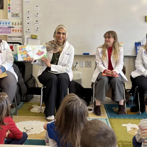 UNE students in health care professions read to local youth.