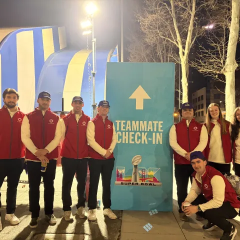 UNE business students pose in front of Levi's Stadium at Super Bowl LX