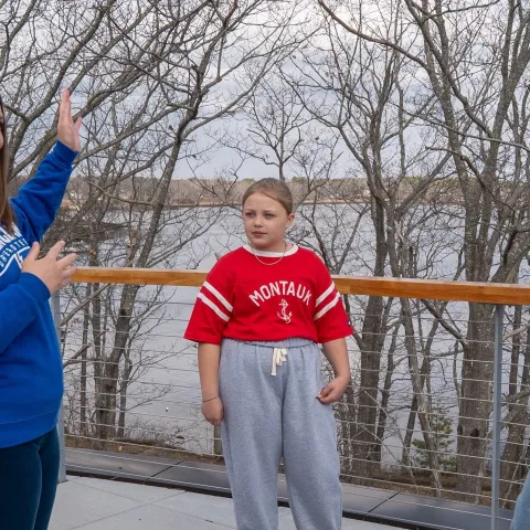 UNE professor and student show a curious middle-schooler the ropes of marine research