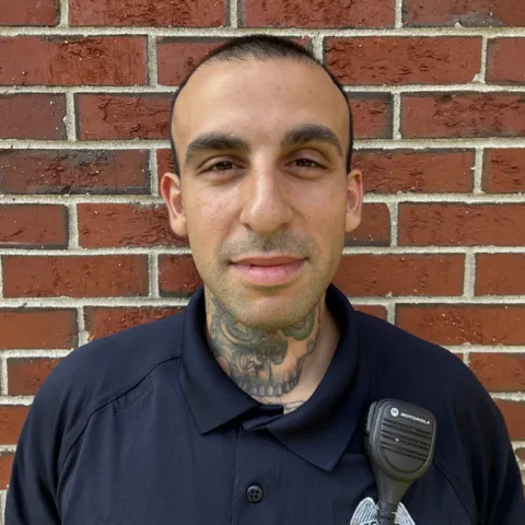 Portrait of U N E security officer Jeremy Hirschl
