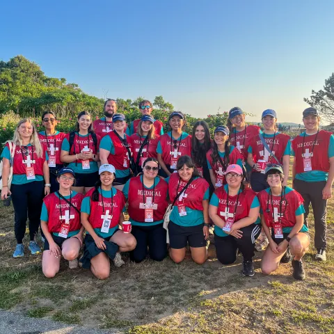 UNE students and volunteers pose at the Beach to Beacon finish line