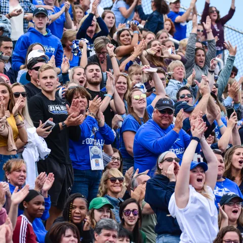 Fans cheer on UNE football in the stands