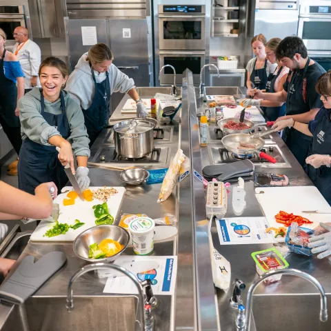 Students cook together in UNE's Teaching Kitchen