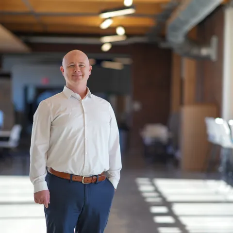 Scott Wood poses in the Harold and Bibby Alfond Center for the Health Sciences