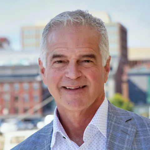 Portrait of U N E Board of Trustees Member Mark Malone