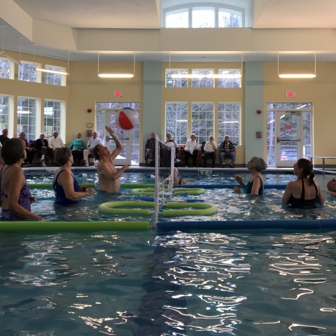 Older adults play water volleyball through U-ExCEL program