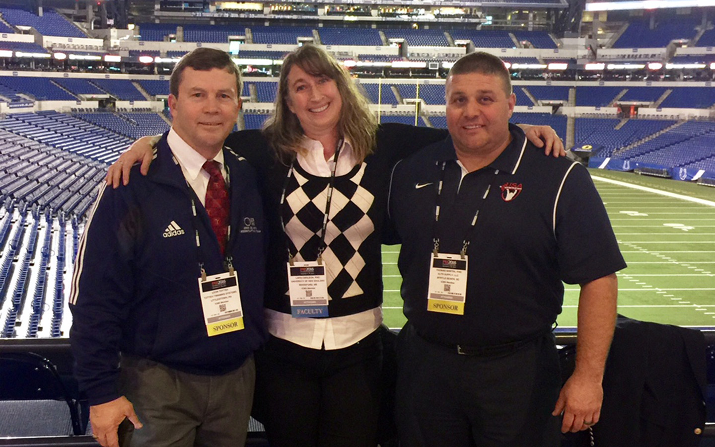 Lara Carlson at Lucas Oil Stadium with Olympic lifting coach Leo Totten and is his former athlete, Tom Martin