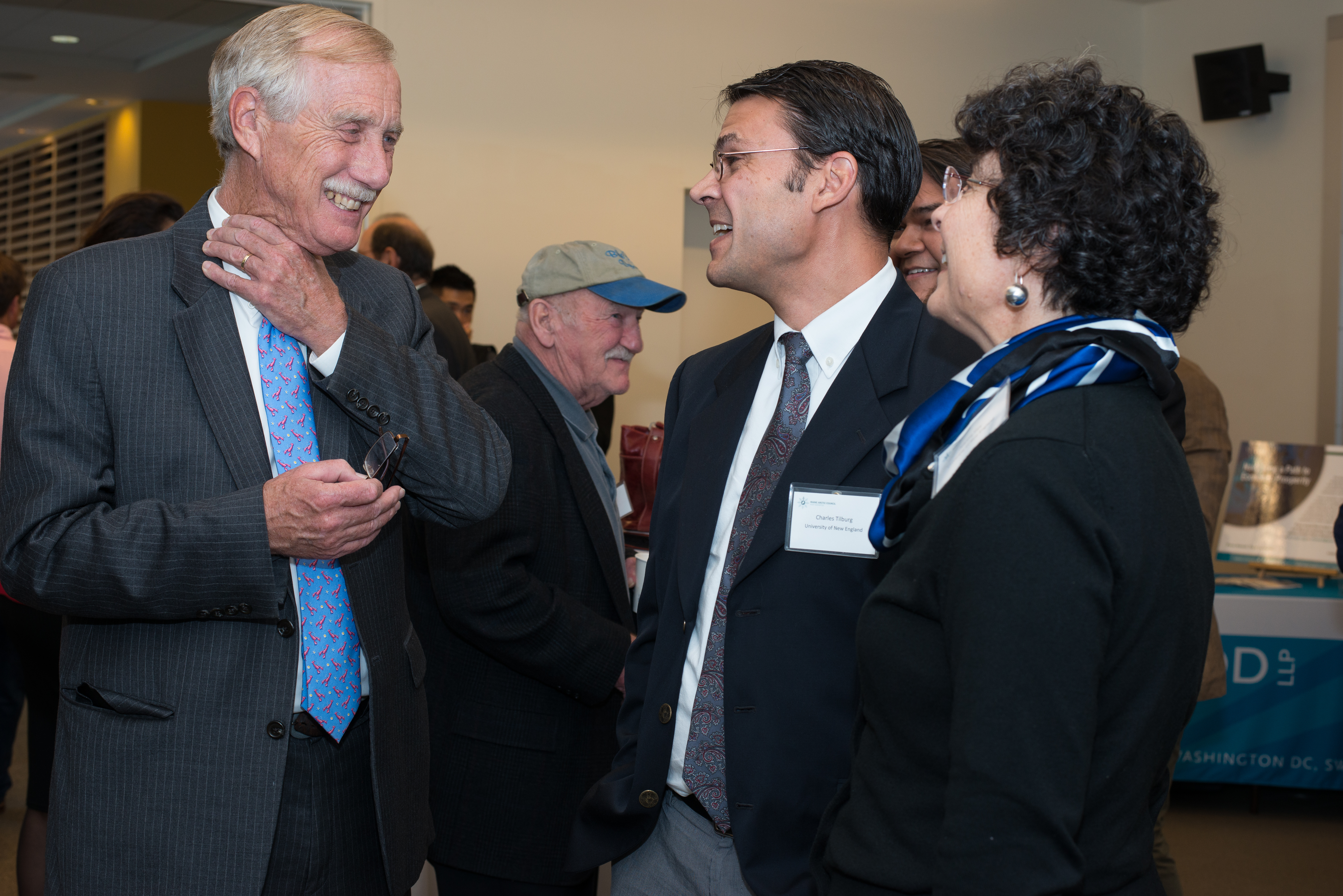 Senator Angus King talks with Dean Jeanne Hey and Associate Dean Charles Tilburg