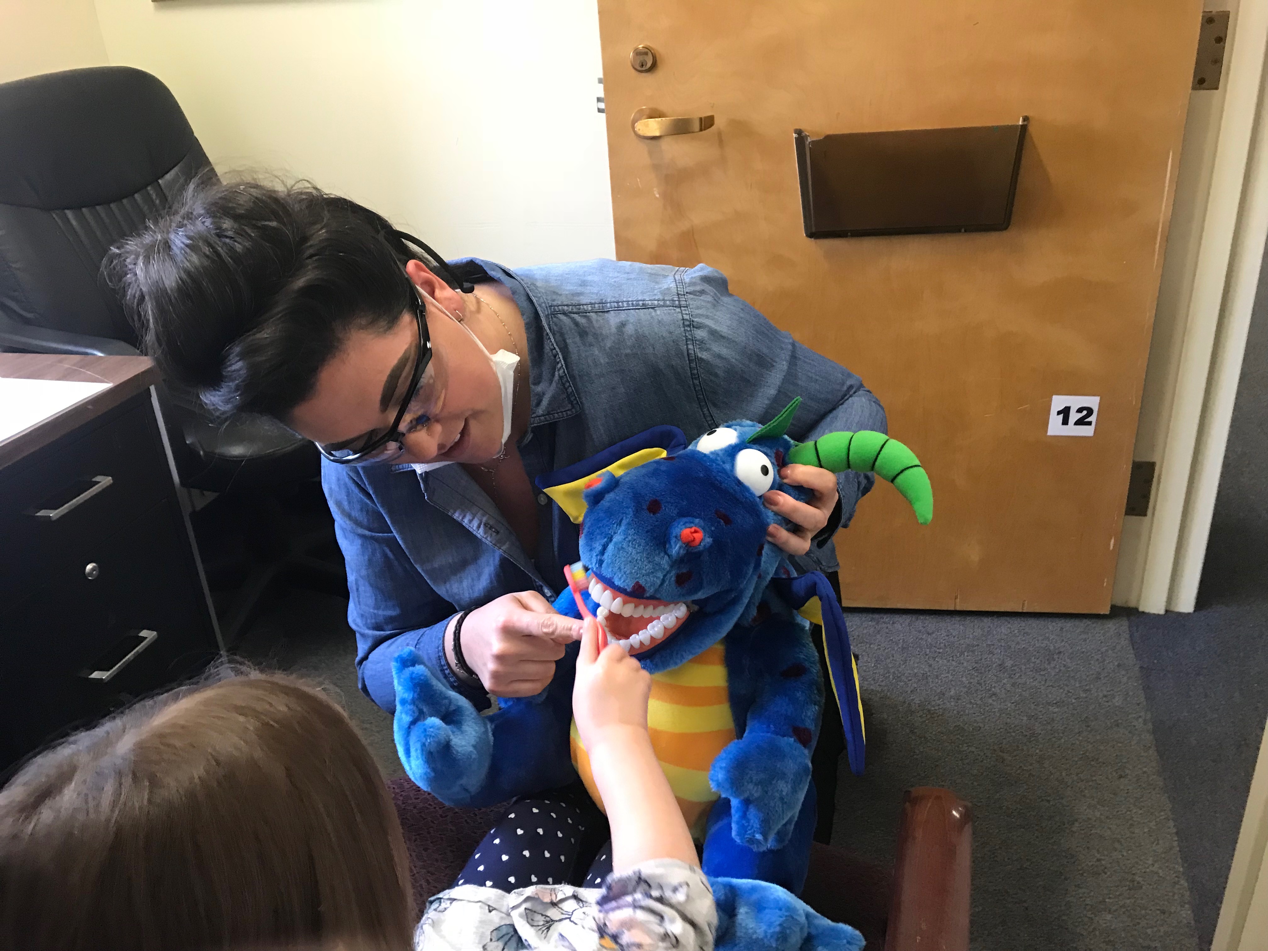 Students and faculty provide free dental screenings for children in Old