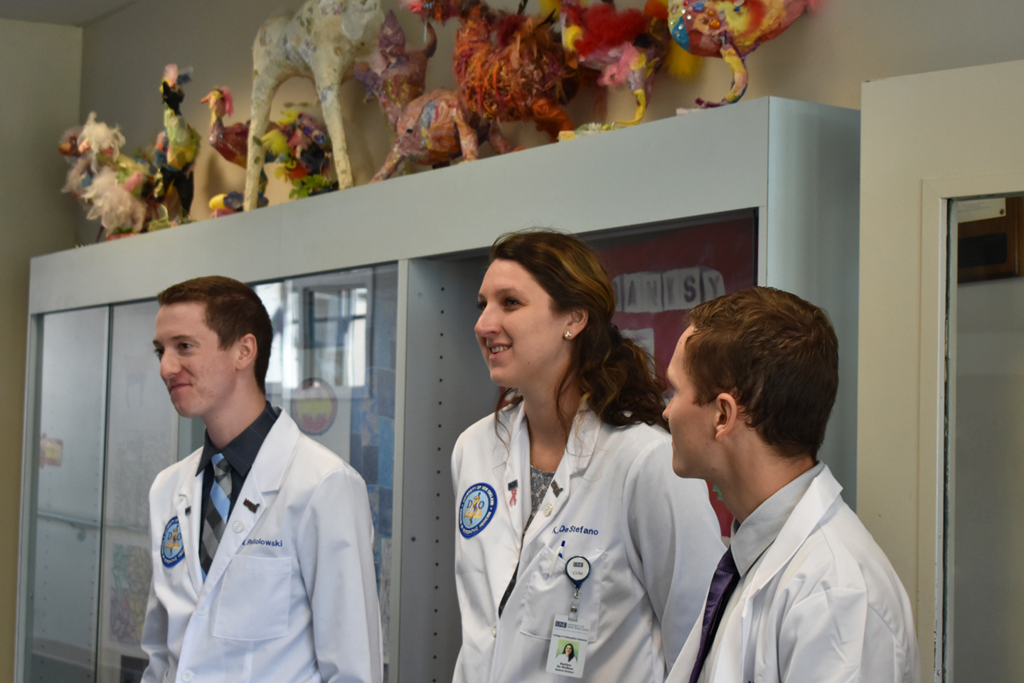 First-year UNE COM students Matt Postolowski, Kaitlyn De Stefano and Carl Minnerath tour the Eslie J. Parquette School, a specia